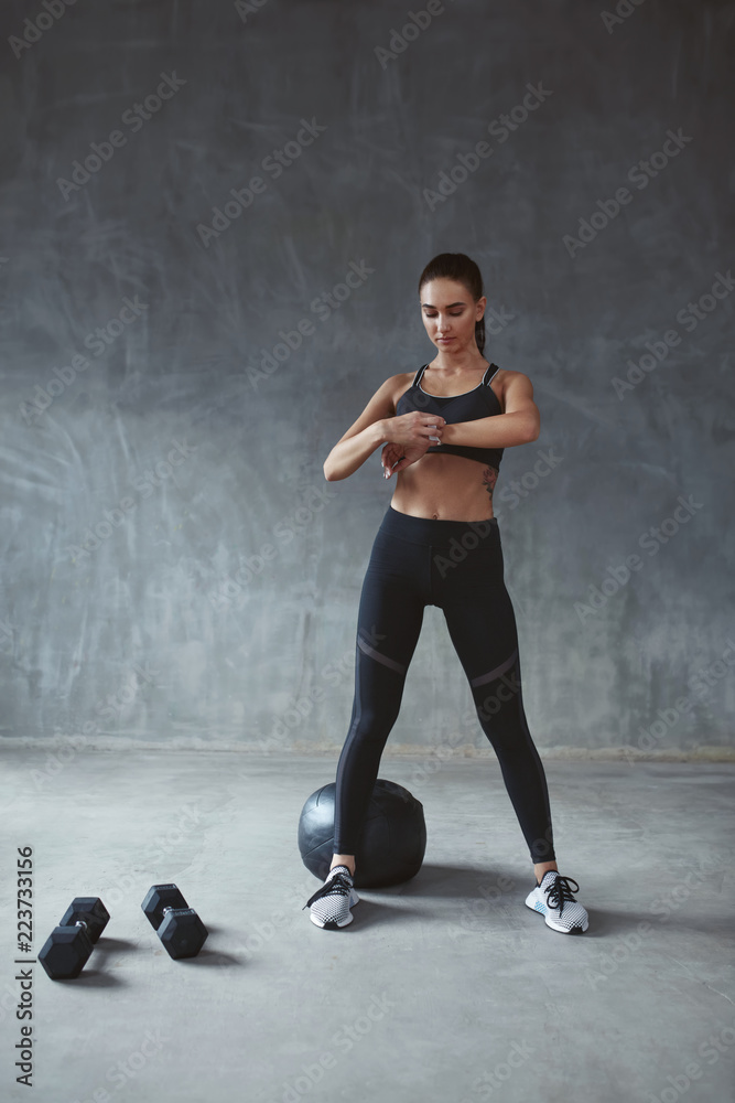 Woman In Sports Fashion Clothes Using Smartwatch On Training Woman In Sports Fashion Clothes Using Smartwatch On Training