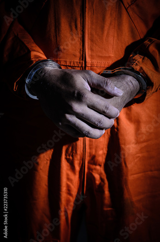 Male prisoners were arrested, handcuffed to a light-dark