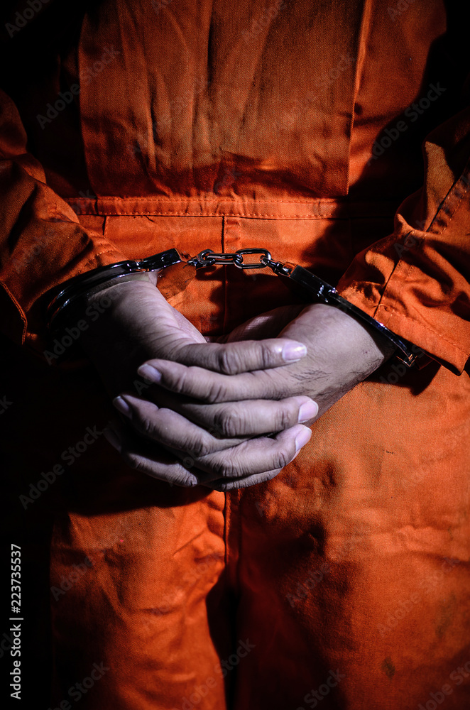 The prisoners were handcuffed behind his back