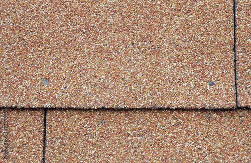 red and tan asphalt shingles on the side of a building