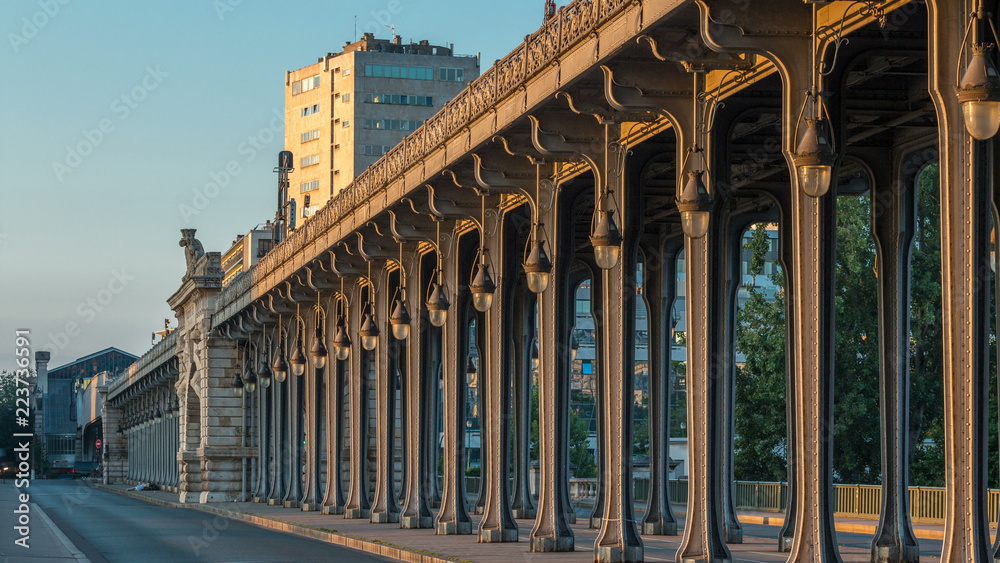 Fototapeta premium Seine bridge Bir-Hakeim during sunrise timelapse in the center of Paris a beautiful summer morning, Paris, France.