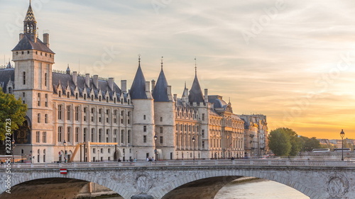 Dramatic sunset over river Seine and Conciergerie timelapse in Paris, France photo