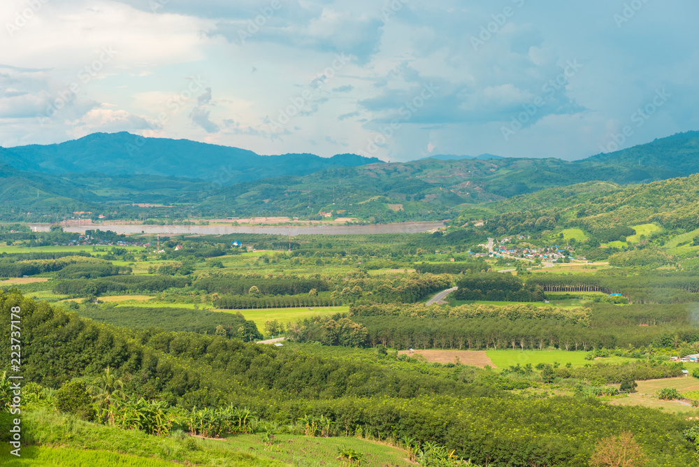 View of Chiang Khong district with khong river and Laos border and green mountain and nice sky View of Chiang Khong district with khong river and Laos border and green mountain and nice sky