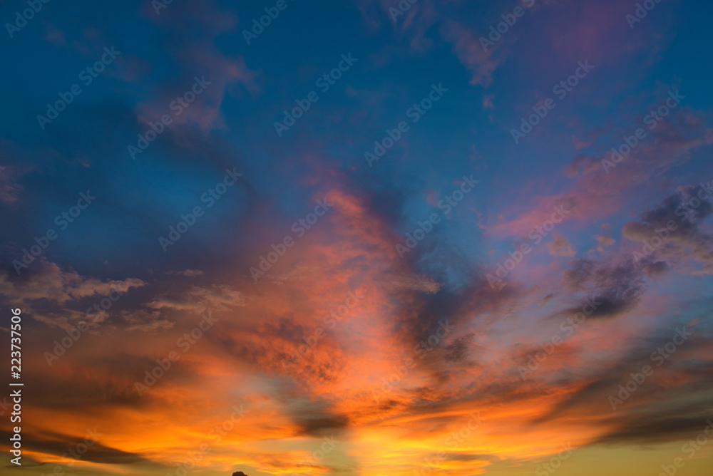 Fototapeta premium Beautiful twilight sky with orange and blue colour dramatic cloud.