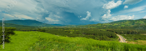 Panorama of mountains and rice fields with road and beautiful sky