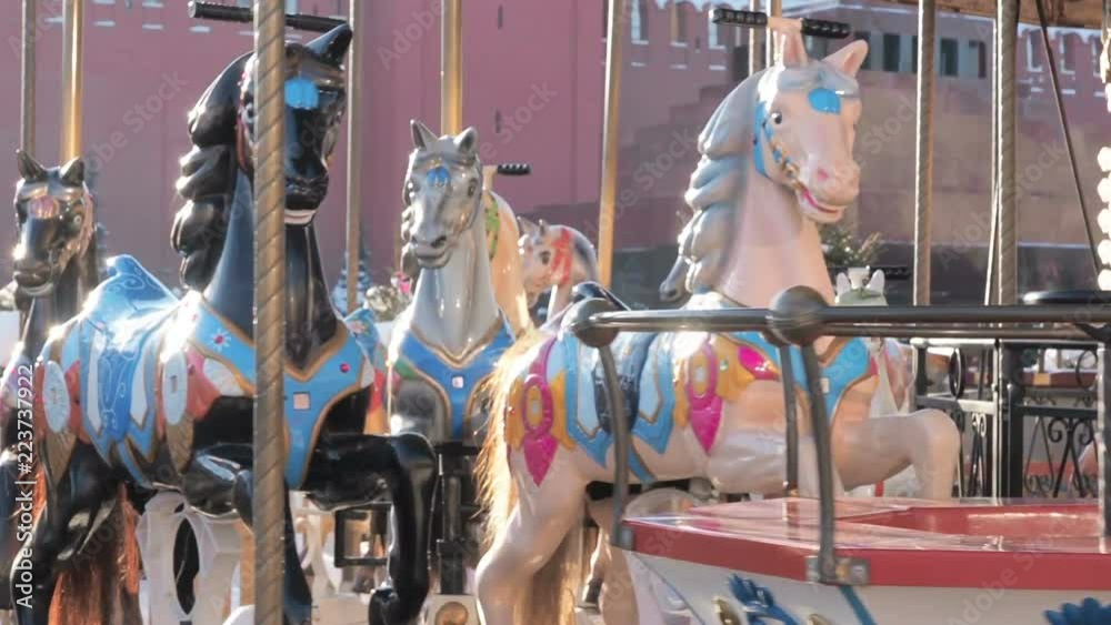 Retro carousel on Red Square decorated and arranged for Christmas New Year. Christmas fair. Roundabout rotates
