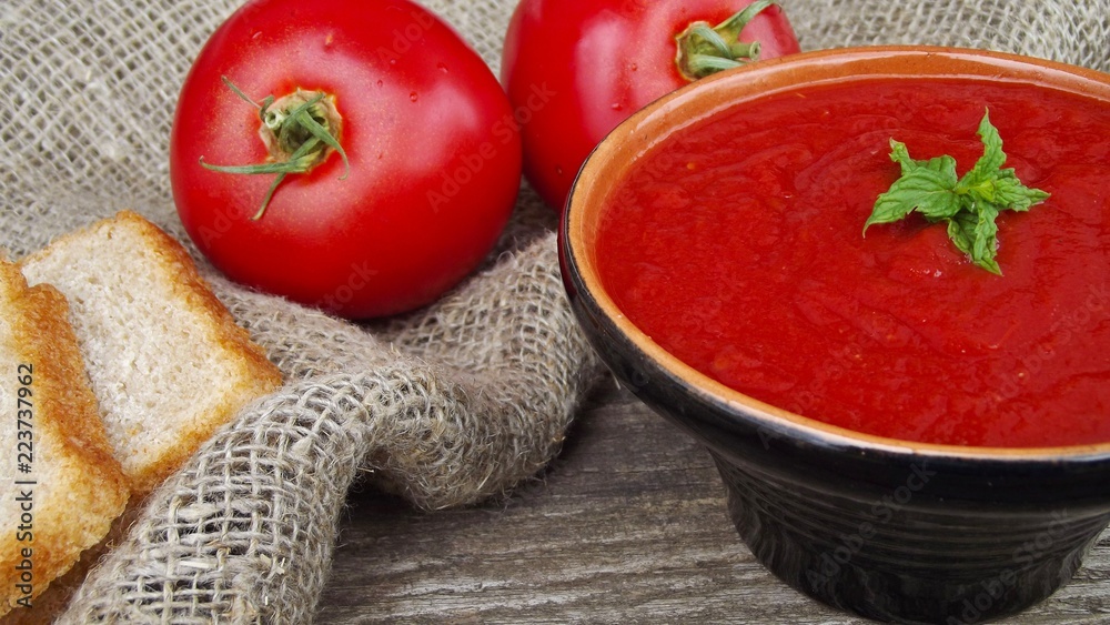 Delicious tomato cream soup on the table. Delicious tomato cream soup on the table.