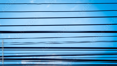 Wires and blue sky background