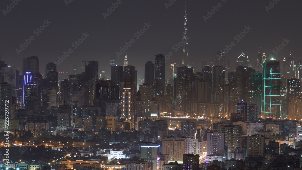 Panorama of Sharjah and Dubai from Ajman rooftop night timelapse, United Arab Emirates