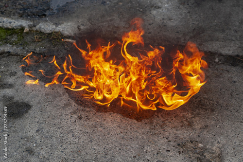 Flame on the asphalt.