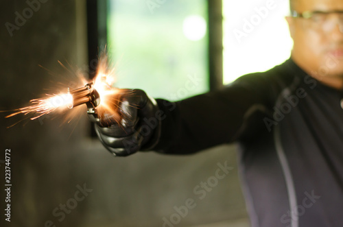 Sparks from the gunfire of men photo