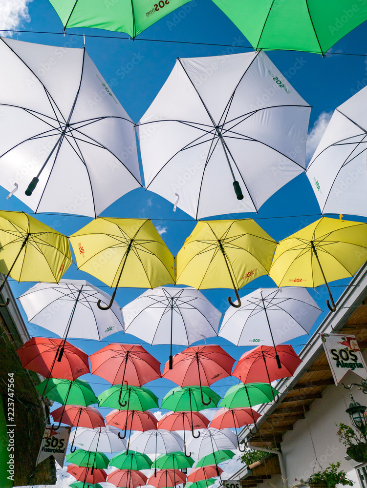 Umbrellas suspended on the streets of Guatape Colombia