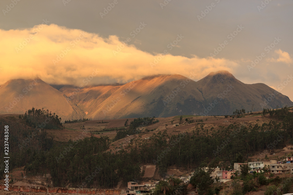 Vulcano in the background of the cityscape of otavalo, ecuador