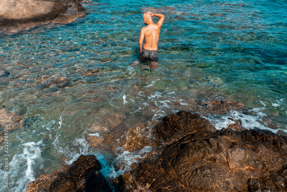young guy in a blue Rocky sea