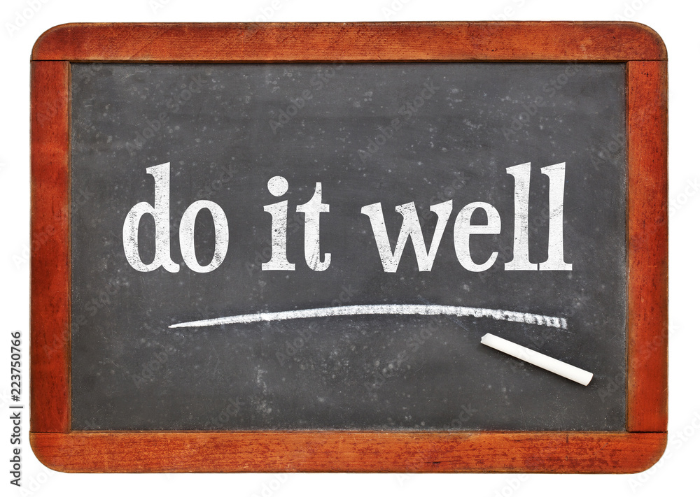 Obraz premium Do it well - motivational note on blackboard