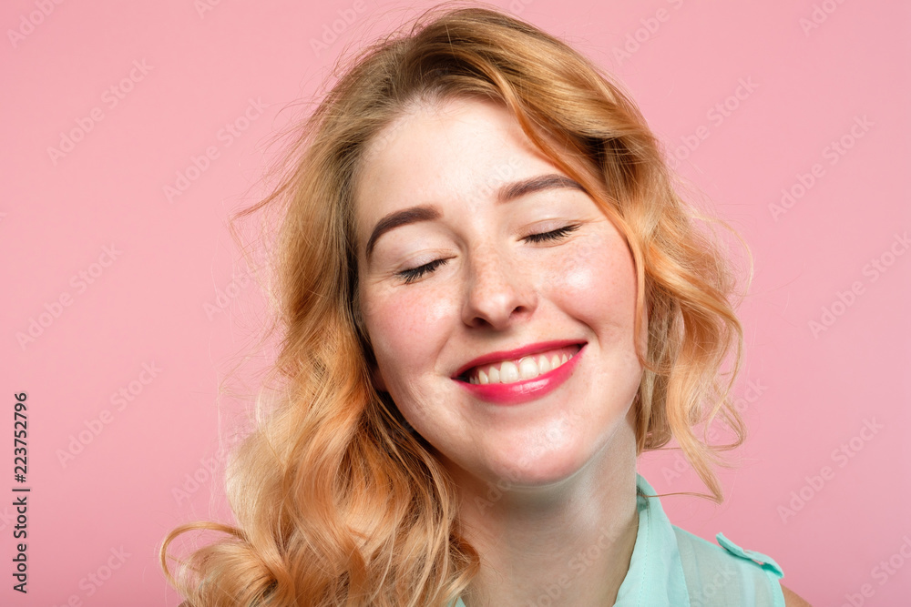 emotion expression. very happy joyful thrilled to bits woman with beaming smile. young beautiful blond girl portrait on pink background. emotion expression. very happy joyful thrilled to bits woman with beaming smile. young beautiful blond girl portrait on pink background.