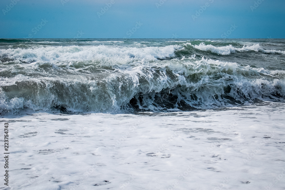 Waves breaking on a beach