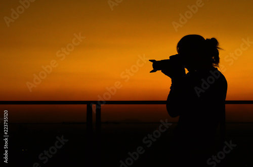 silhouette of woman with sunset