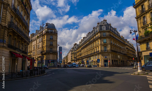 Crossroad of streets of Paris without tourists with a beautiful architecture and cloudy sky (Saint-Germain, 6th district)