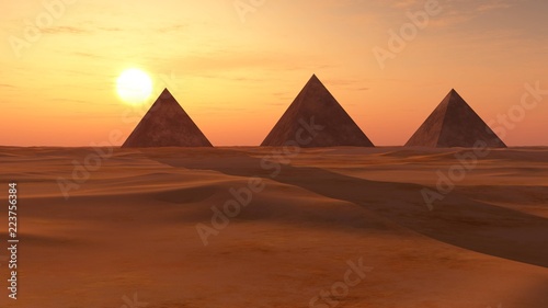 desert of sand with pyramids at sunset.