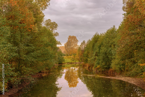 Fototapeta Naklejka Na Ścianę i Meble -  Colorful autumn landscape of river and bright trees and bushes