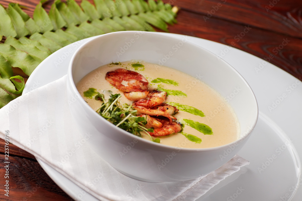 Creamy cheese soup with grilled shrimps Creamy cheese soup with grilled shrimps