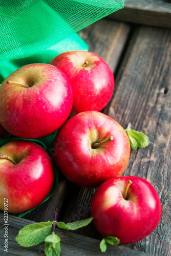 group of red apples on wooden natural background, fresh natural food and vitamins concept in rustic style