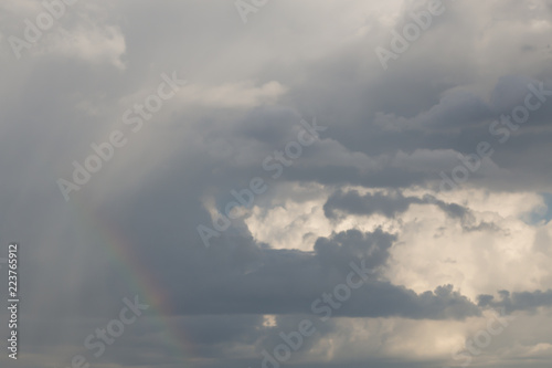 Expressive cloudscape with rainbow after rain © Lenaika