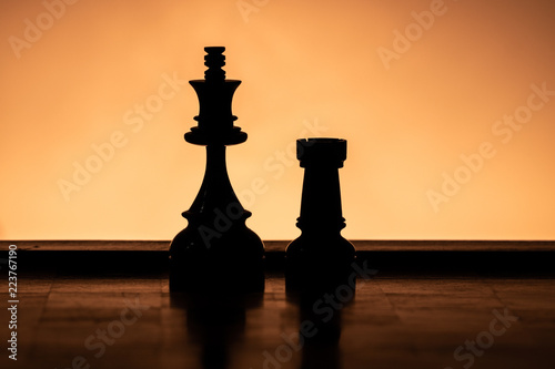 Silhouette King and Rooke Chess Pieces doing the Castling Game Move