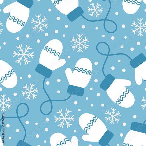 Vintage winter seamless pattern with mittens and snowflakes on blue background. Shabby texture. Vector illustration