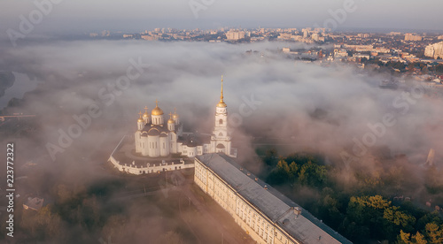 An incredibly beautiful misty morning over Vladimir. Aerial view on Assumption Cathedral in the fog. Russia. Vladimir photo