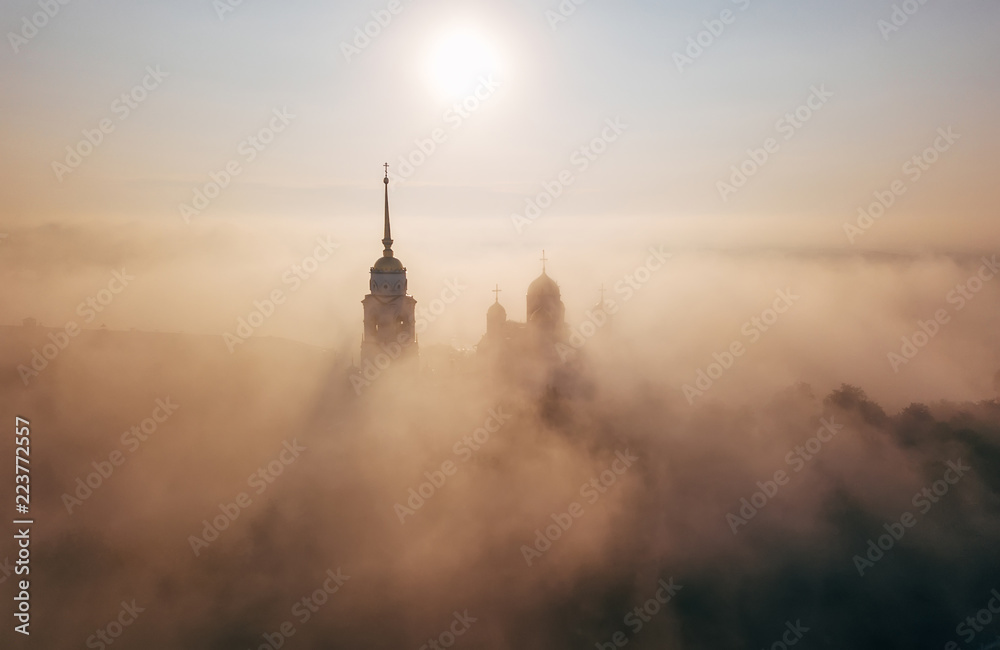 An incredibly beautiful misty morning over Vladimir. Aerial view on Assumption Cathedral in the fog. Russia. Vladimir