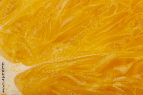 Quadro su tela Flesh of juicy ripe orange as background or backdrop, close-up abstract blurred