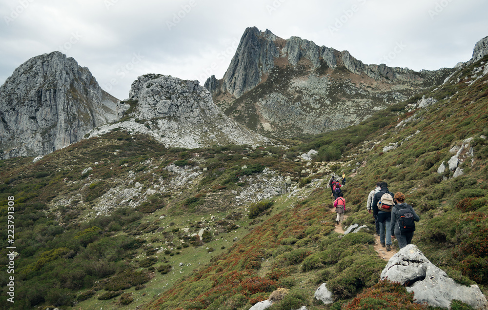 hikers walking towards Pico Torres in Asturias, Spain