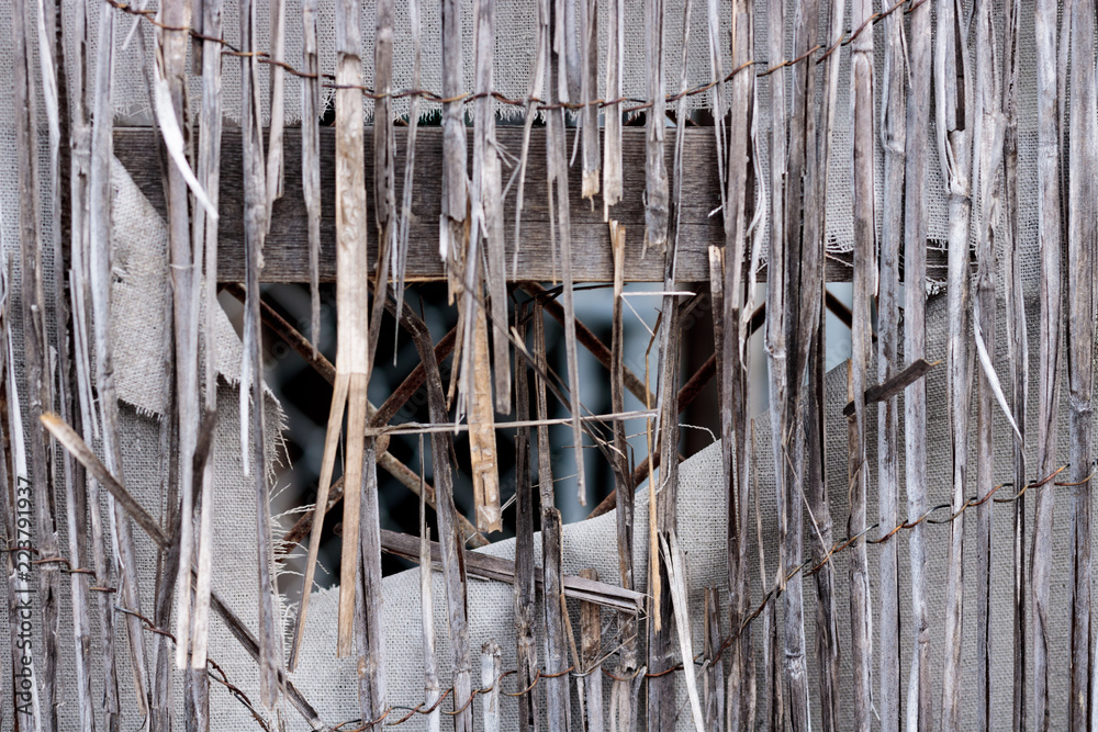 Vintage bamboo rattan close-up of a dilapidated retro worn fence, white ...