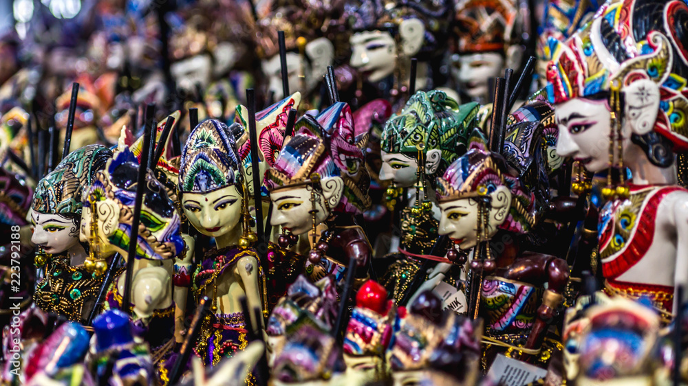 wooden puppet with traditional batik fabrique called 'Wayang Golek