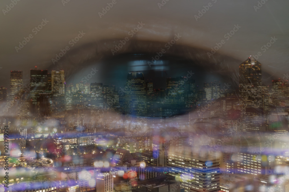 Obraz premium double exposure of business concept, business eye man look trough the cityscape or landscape in the city with bokeh light