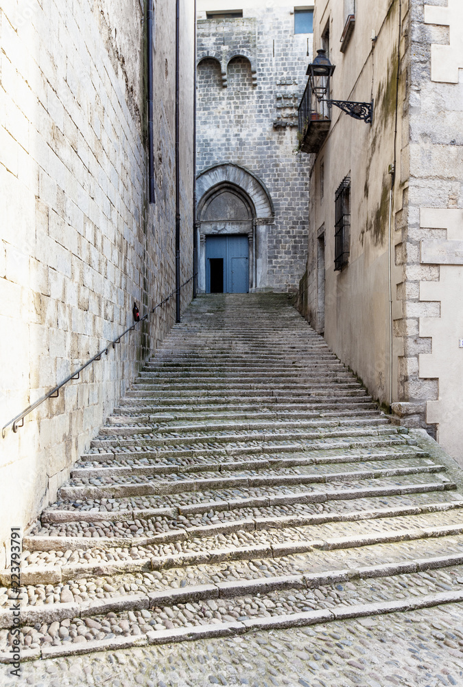 Steep stairs and narrow street in old town of Gerona, Spain