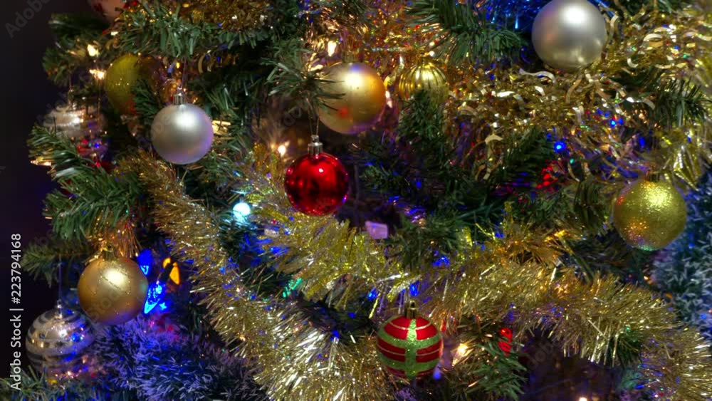 Christmas Tree Ornaments and Lights dolly shot. 4K UHD. Dolly shot of decorations on a Christmas tree. 4K. UHD.
Christmas Tree Ornaments and Lights dolly shot. 4K UHD. Dolly shot of decorations on a Christmas tree. 4K. UHD.