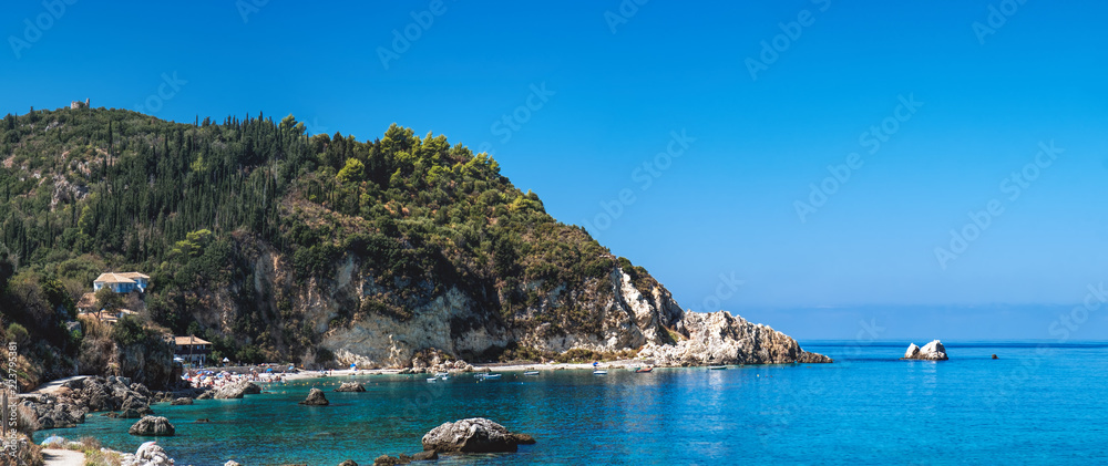 Idyllic sunny day on the rocky shore of north west coast of Lefkada island, Greece