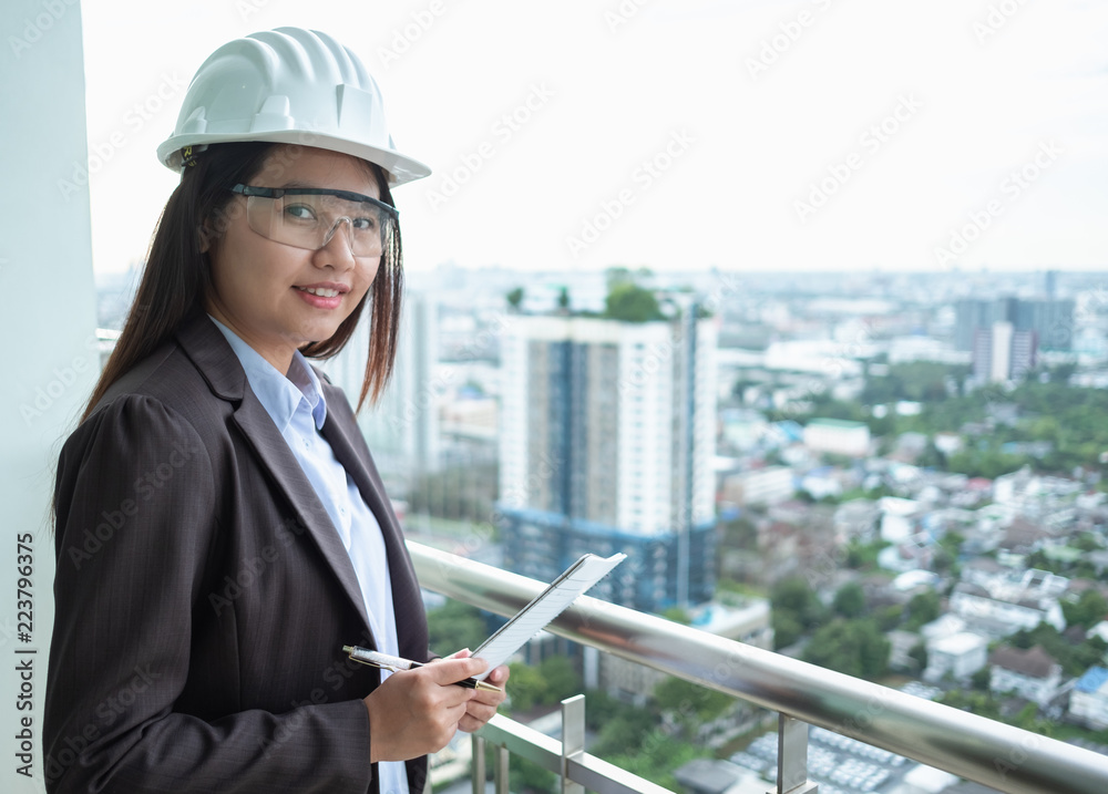 Portrait asia woman engineer working at construction site Portrait asia woman engineer working at construction site