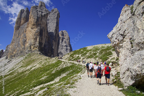 Hikers near a pass in the Drei Zinnen area photo