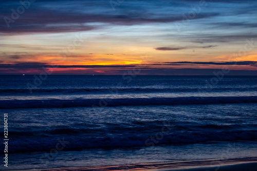 Obraz na płótnie Blue Shaded Sunset at Karon Beach Over the Ocean w salonie