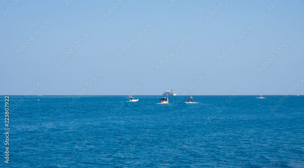 a fishing boat with deep blue dark sea in karimun jawa