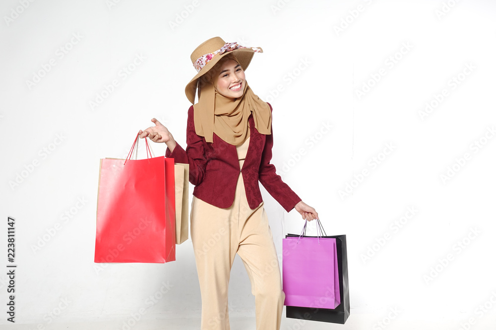 Portrait of a beautiful young muslim woman with shopping bags Portrait of a beautiful young muslim woman with shopping bags