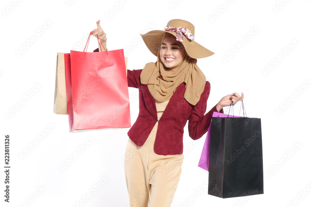 Portrait of a beautiful young muslim woman with shopping bags Portrait of a beautiful young muslim woman with shopping bags