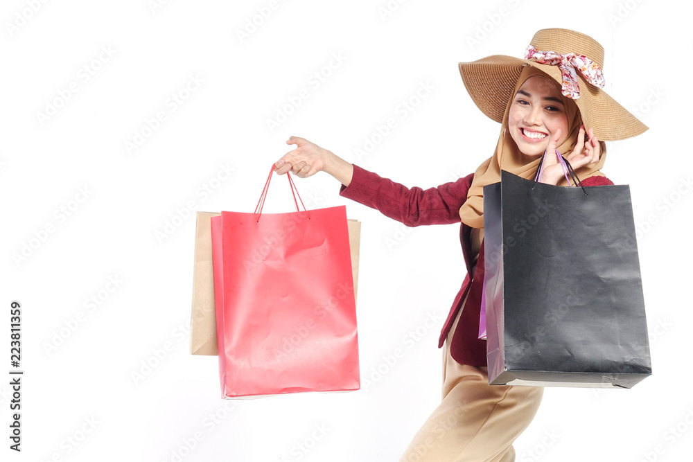 Portrait of a beautiful young muslim woman with shopping bags Portrait of a beautiful young muslim woman with shopping bags