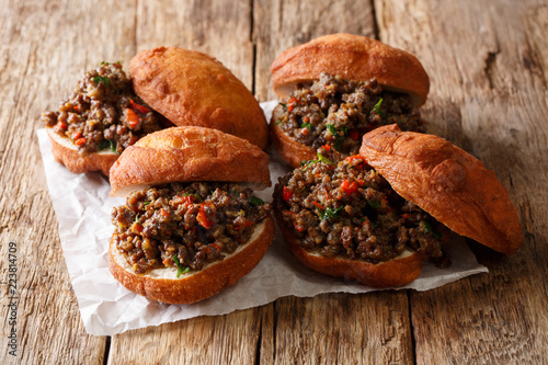 Cuadro en lienzo Traditional South African Vetkoek fried deep-fried buns stuffed with minced meat curry close-up on the table