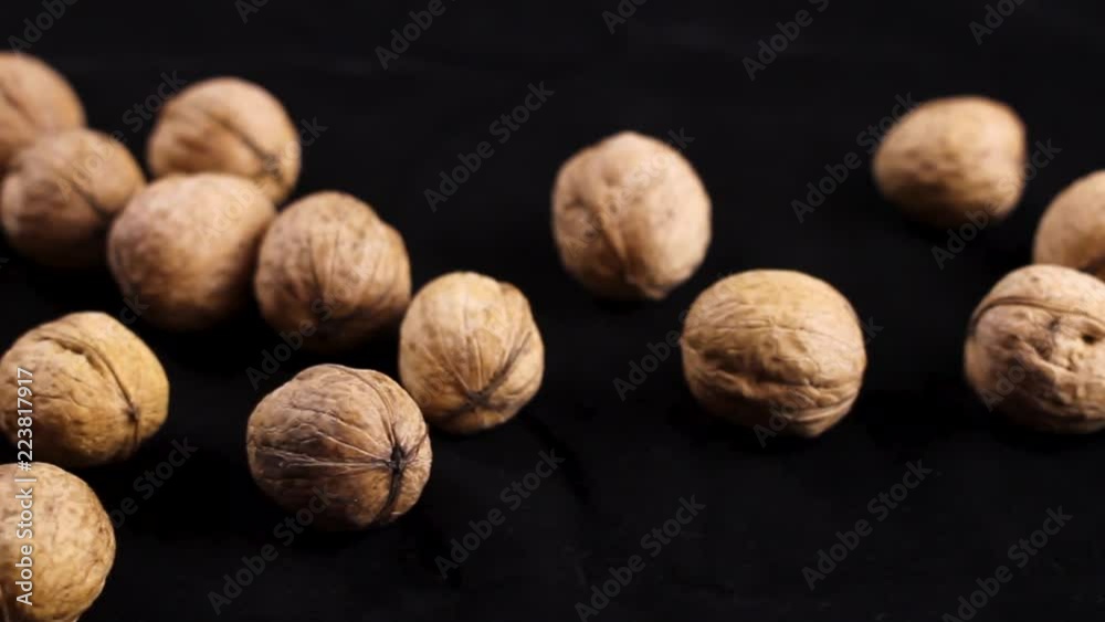 Nice walnuts on black background. Close up. Nice walnuts on black background. Close up.