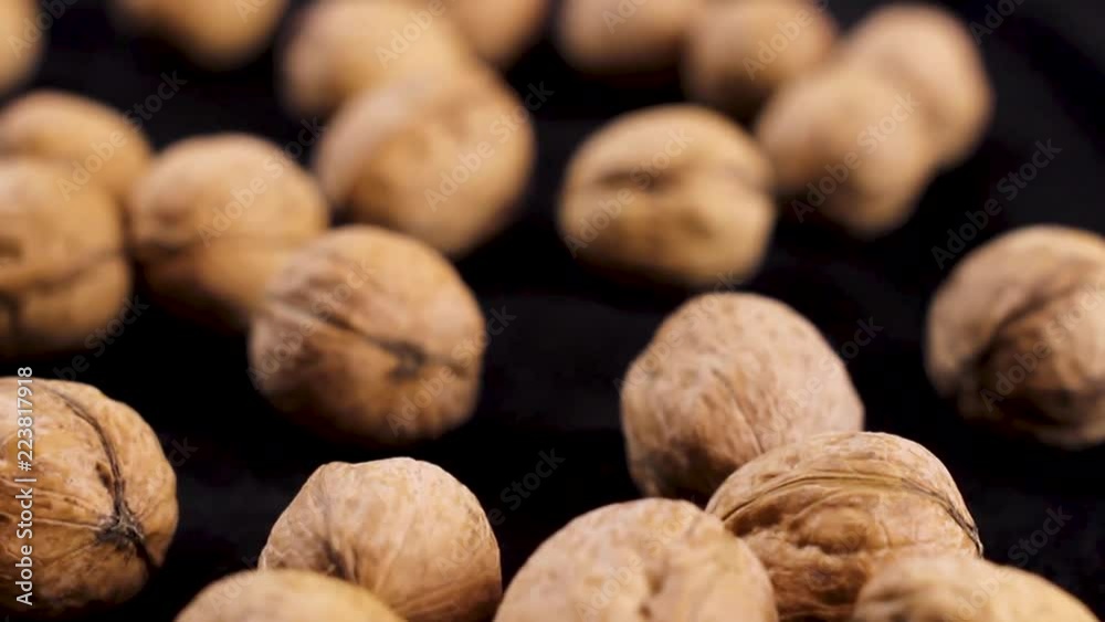Nice walnuts on black background. Close up. Nice walnuts on black background. Close up.